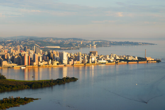 Porto Alegre, Brazil skyline. City located in Rio Grande do Sul State. Porto Alegre downtown and harbor reflecting in Guaiba Lake / River.