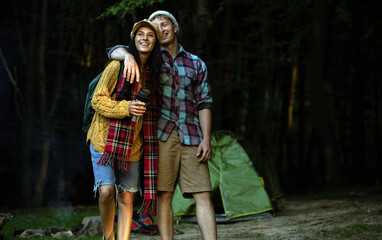 Love couple. Camping couple. Camping day. Forest background. Emotion man and woman. 