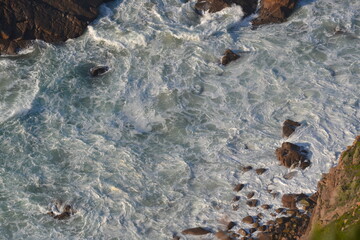 Sea and ocean foam, waves, rocks, blue water from Portugal Cabo da Roca