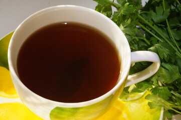 Hot herbal tea in a bright, colorful cup.