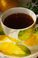 Hot herbal tea in a bright, colorful cup. © Adam Bialek