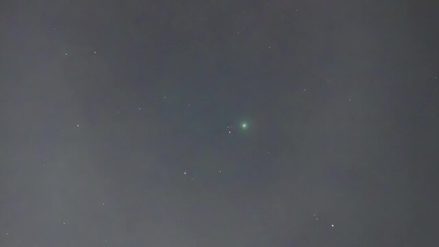 Comet Neowise C/2020 F3 as seen from the polluted Santiago de Chile city night sky. We can see the bright comet nucleus, the coma and a small tail moving in between the night stars 
