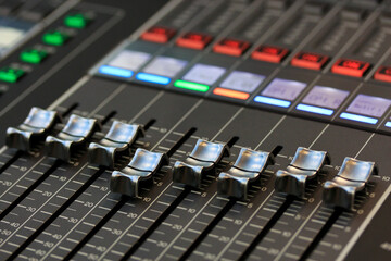 faders of a digital sound mixing console