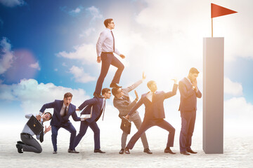 Career progression concept with businessman climbing stairs