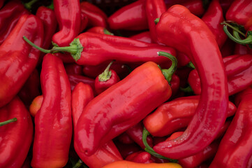 A pile of red peppers, close up