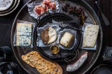 French Cheese with rustic tine tableware & cutlery