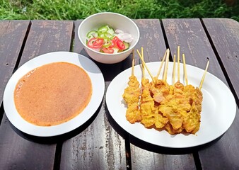 Pork Satay, Grilled Pork Served with Peanut Sauce or Sweet and Sour Sauce in White Container