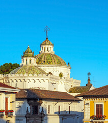 Domes of the Compania de Jesus church with mosaic inlay at sunset, Quito, Ecuador.