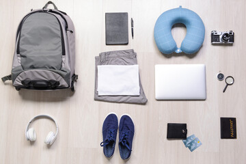 Set of travel accessories for men on wooden background