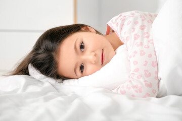 Little girl suffering from sleep disorder in bedroom