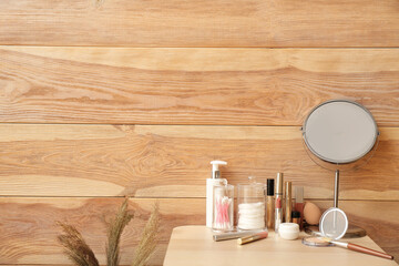 Set of decorative cosmetics and mirror on dressing table