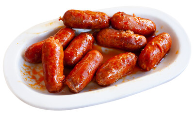 Spanish appetizer, warm mini chorizo sausages choricitos de Navarra in ceramic bowl. Isolated over white background