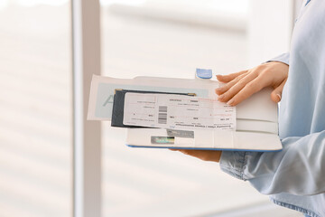Woman with travel organizer indoors