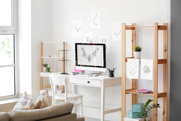 Workplace of jewelry designer in office