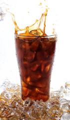 Ice cubes splashing into glass of water.