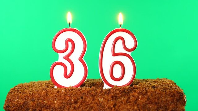 Cake with the number 36 lighted candle. Chroma key. Green Screen. Isolated
