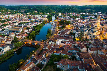 Flight over the evening city of Perigueux at sunset. France
