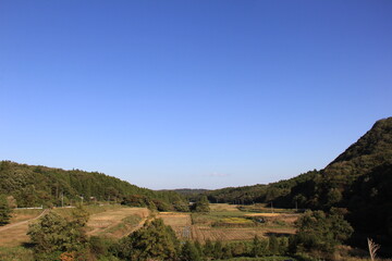 Fototapeta na wymiar 田畑のある風景
