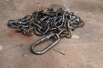 Rusty Metal Chains On Wooden table