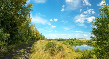 Summer landscape with lake and blue sky