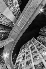 Elevated road through residential building in Hong Kong city.