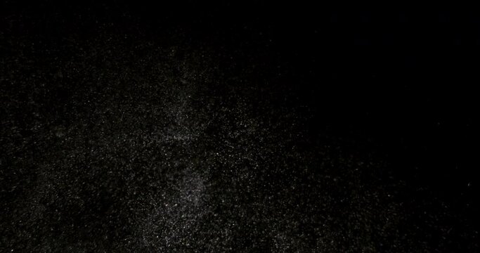 White dust powder isolated on black background