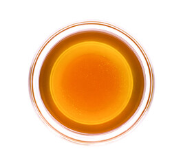 Honey in glass bowl isolated on white background with clipping path. Top view. Flat lay.