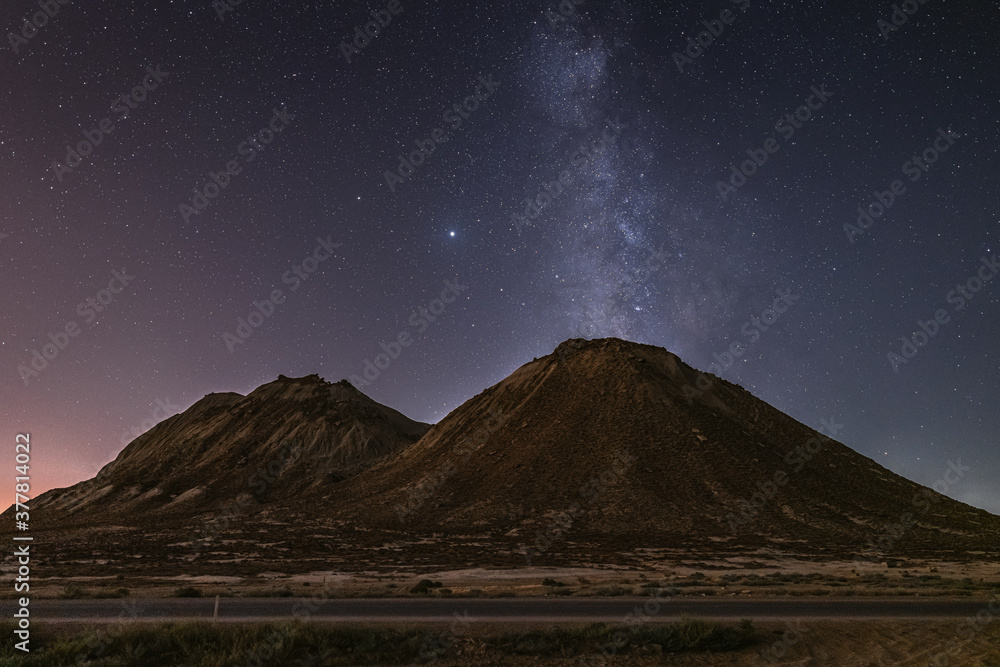 Wall mural starry sky with milky way galaxy over mountains