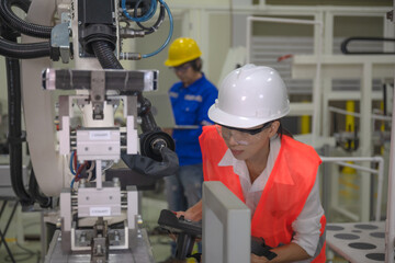 woman working engineering or technical inspection the system  of machinery by online mobile device connecting to ensure working in order by checklist part and quality control