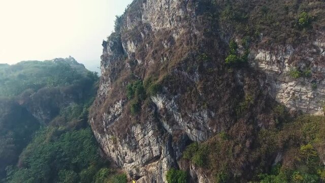 Gigantic tropical mountain rock with greens in summer HD Stock Footage Video