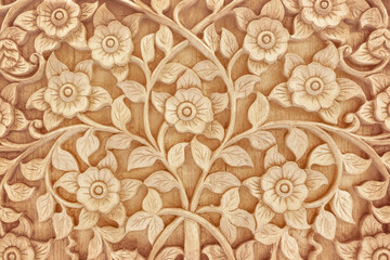 Fototapeta na wymiar Pattern of flower carved on wood background