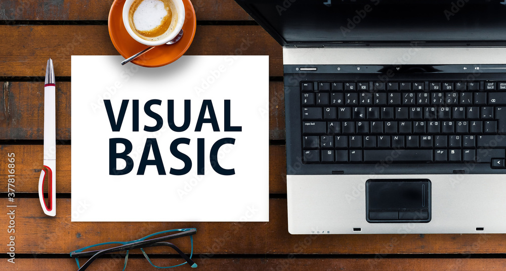 Poster visual basic programming language. paper width words visual basic and laptop, glasses and coffee on 