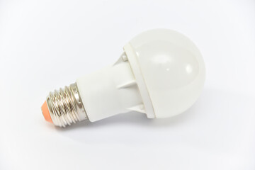 A white light bulb on a white background