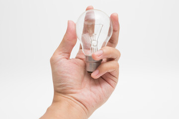 Hand holding a tungsten light bulb  on white background