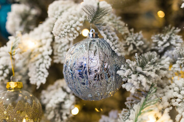 Christmas-tree decorations on a christmas fir-tree. Holidays and decor concept.