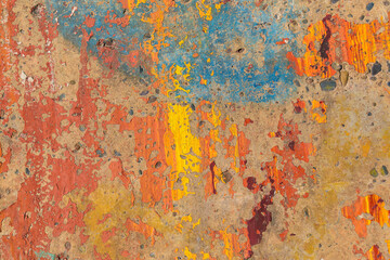 Concrete wall with old multicolor paint. Concept multicolored backdrop, background.