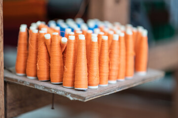 Rolls of spun cotton in a textile factory.Rolls of industrial cotton fabric for clothing cloth...