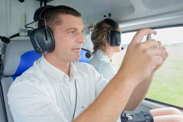 man recording video of his take-off in light aircraft