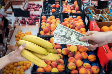 man who takes care of his health buys fruit in a store