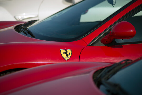Mulhouse - France - 13 September 2020 - Closeup of Ferrari lofo on red car alignment parked in the street