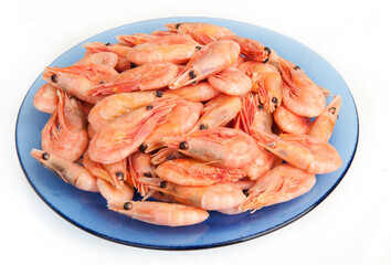 Boiled shrimp on a blue plate