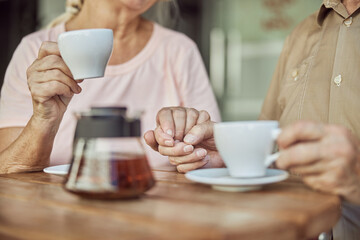 Senior couple in love sitting in a cafe