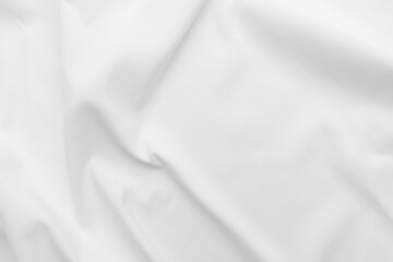 Obraz premium Abstract white fabric texture background. Cloth soft wave. Creases of satin, silk, and cotton. 