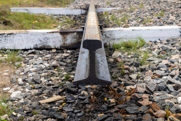 Metal railway rail. A piece of iron rail.
