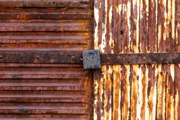 Old door with an old lock. Old padlock.