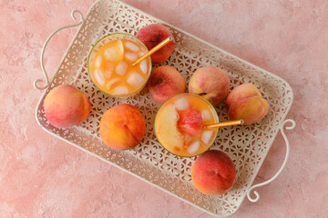 Composition with fresh peach juice on table