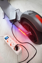 Battery charging process of electric motorized scooter.