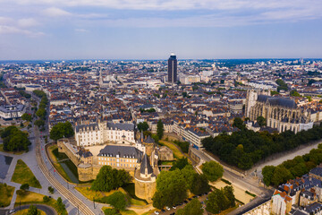 Drone view of ancient Chateau des ducs de Bretagne and Nantes Cathedral on background of downtown...