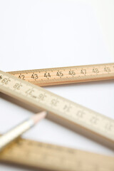 pencil and close up of folding ruler