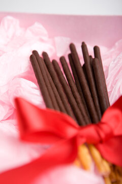 chocolate stick with red ribbon